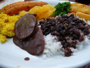 Plate of traditional Braziian feijoada.